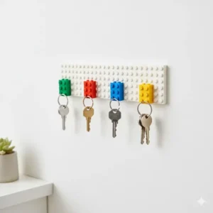 Playful colorful building bricks used as interesting key holders on a wall-mounted baseplate.