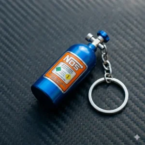 A custom jdm keychain attached to a car key inside a sports car ignition.