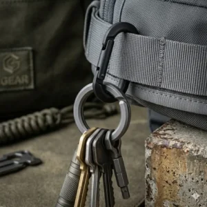 A tactical gear arrangement showcasing the strongest key ring attached to a heavy-duty carabiner and belt.