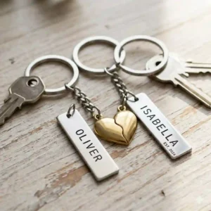 Two matching split-heart couples metal key chain with name stamped on each piece.