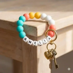 Colorful silicone beaded wristlet key chain with name spelled out in alphabet blocks.